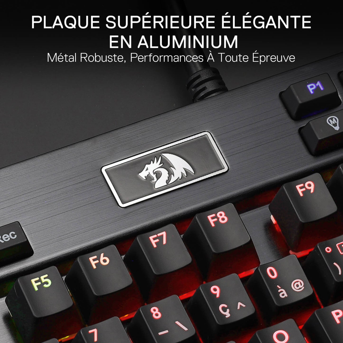 Gaming keyboard with metallic plaque and dragon logo on a dark background