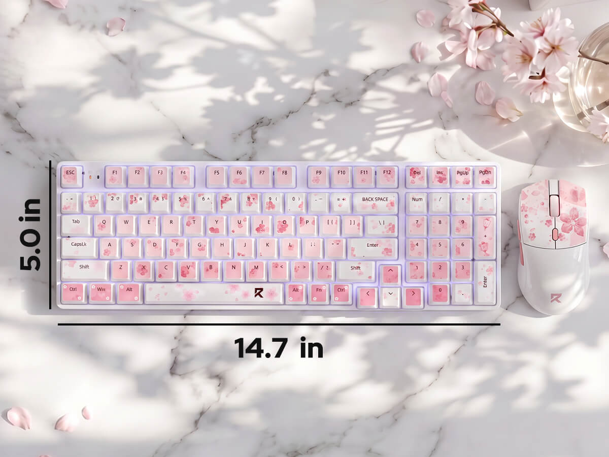 A pink and white cherry blossom themed mechanical keyboard and matching mouse set on a white marble surface with cherry blossom petals and soft shadows. Black dimension lines indicate a width of 14.