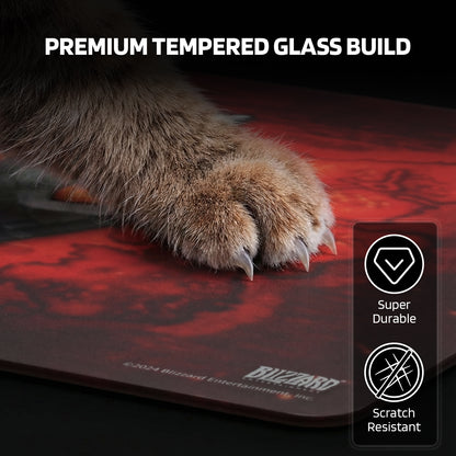 The pad’s "PREMIUM TEMPERED GLASS BUILD" is showcased: it’s super durable and scratch-resistant, even against a cat’s claws.