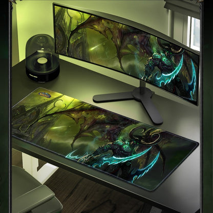 Gaming setup with monitor, mouse pad, and chair on a desk.