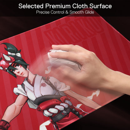 A hand glides a mouse on the Kiriko mouse pad, highlighting its "Selected Premium Cloth Surface" that enables precise control and smooth movement.