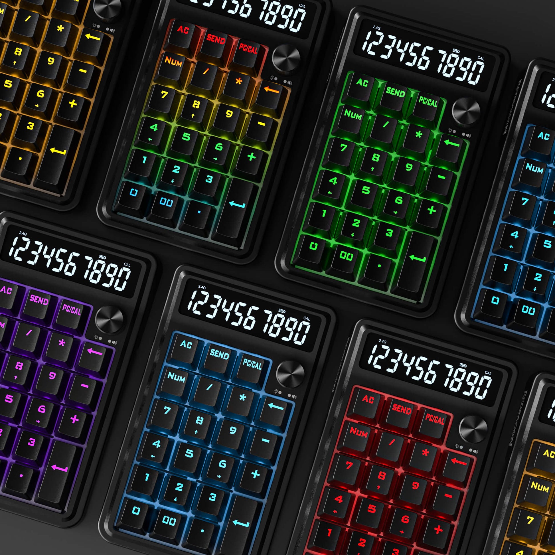 Multiple calculators with colorful backlit keyboards on a dark background