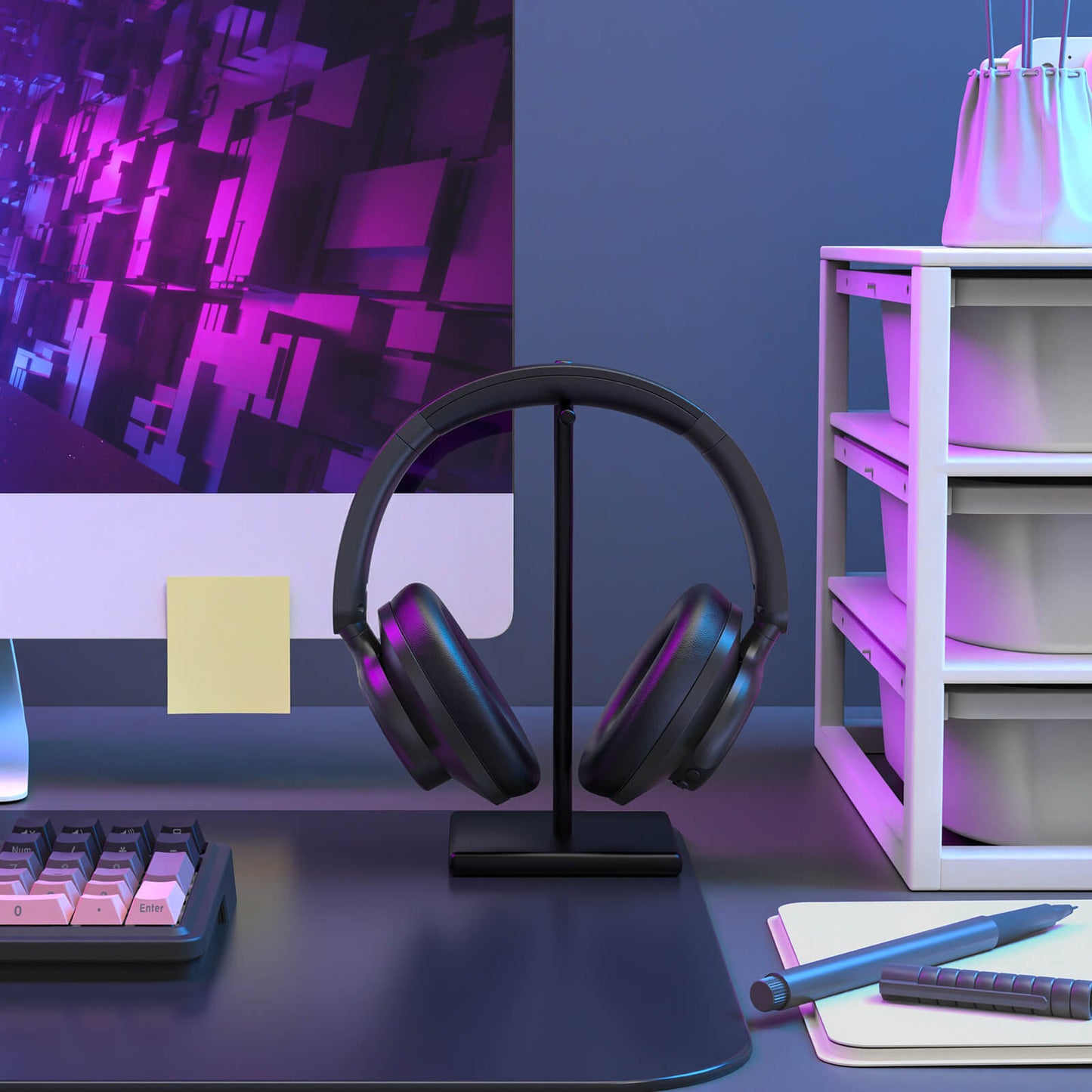 Black headphones on a stand in front of a computer monitor with a purple and blue color scheme.