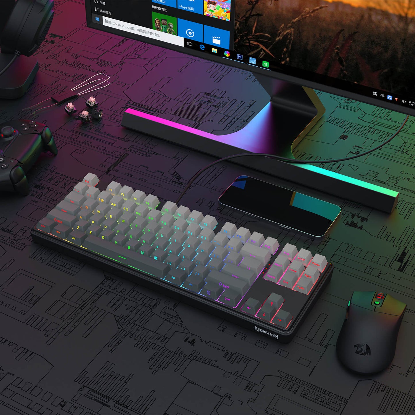 Redragon Gaming setup with keyboard, mouse, and monitor on a detailed desk map