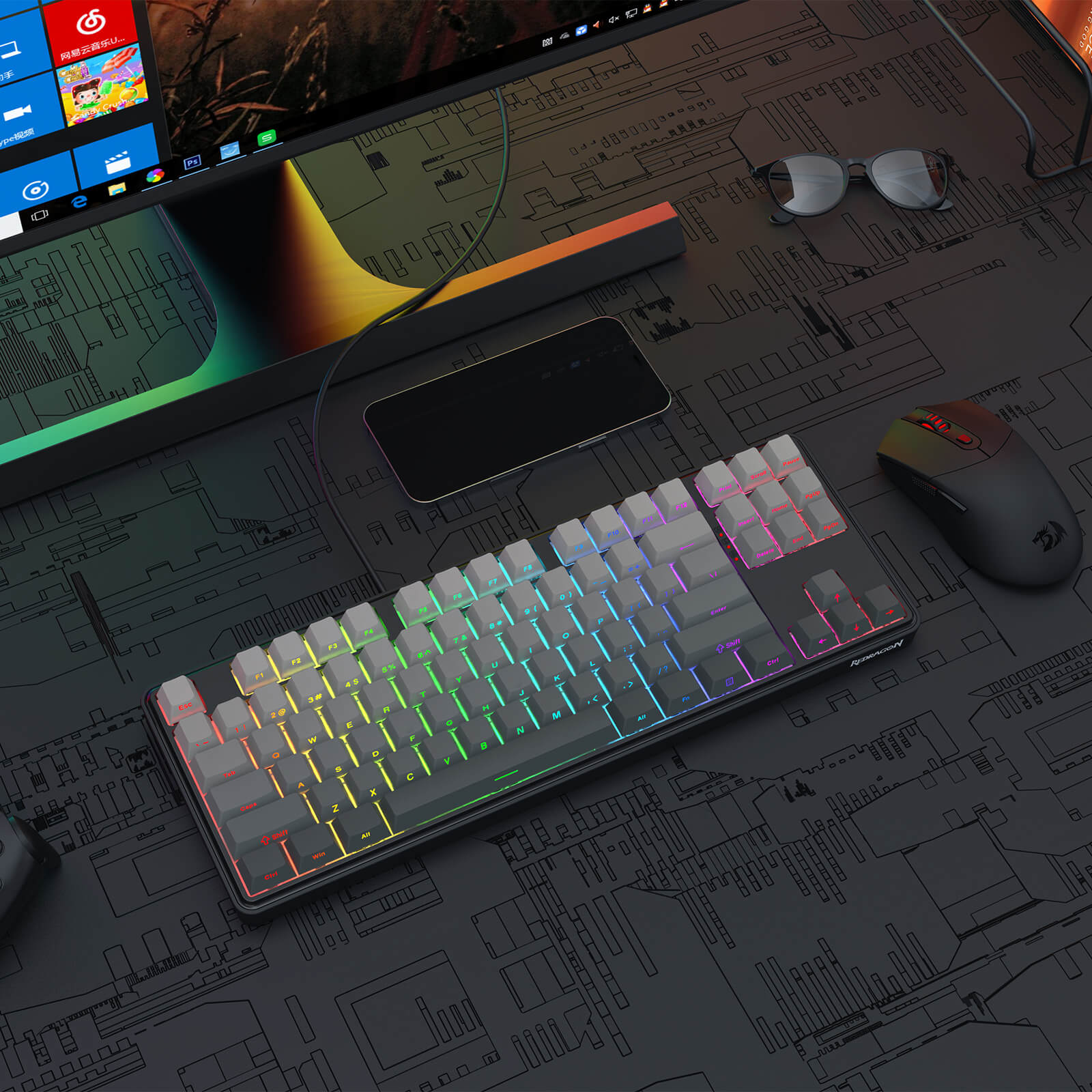 Redragon K707 HE Rapid Trigger Gaming keyboard with RGB lighting on a desk with a computer monitor and mouse.