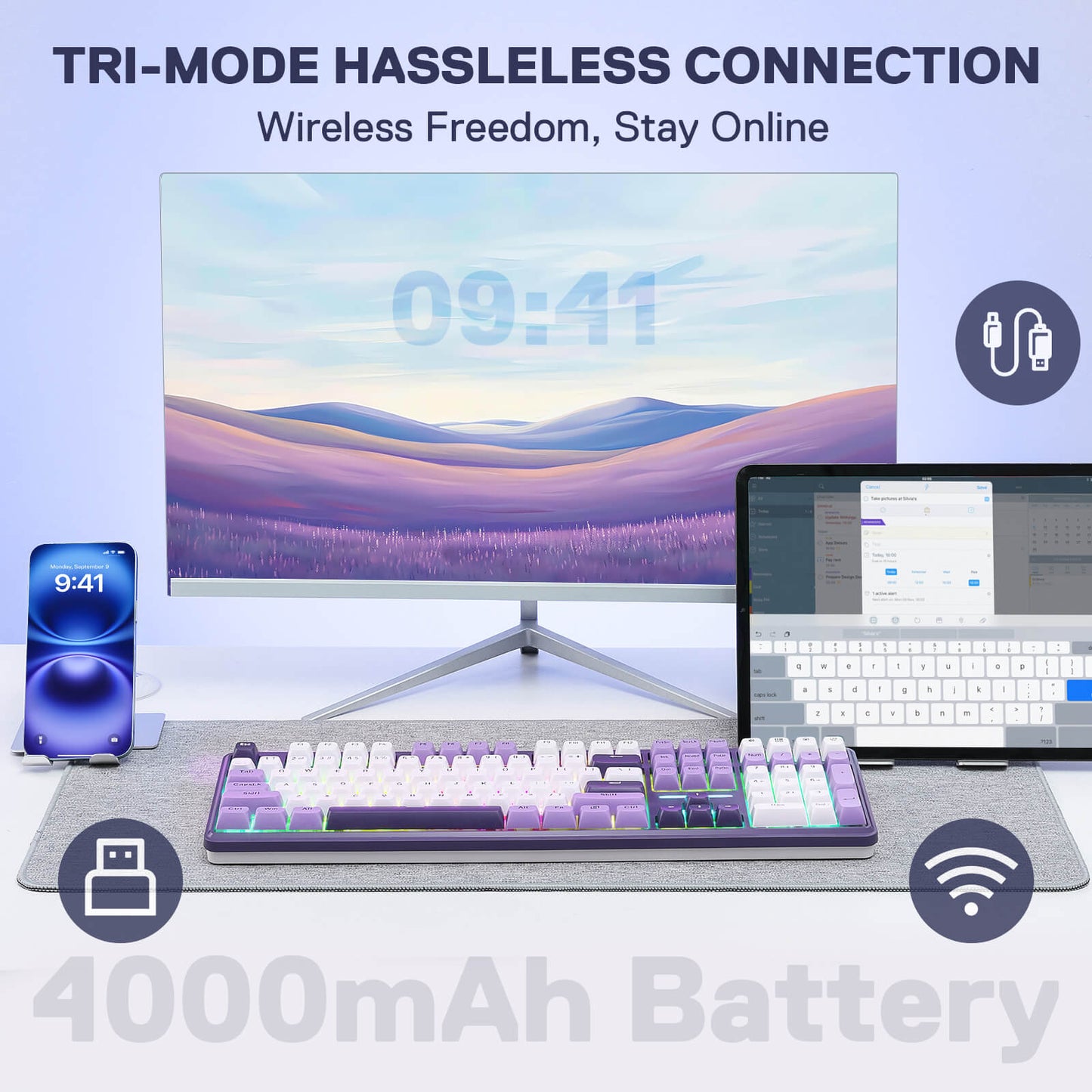 Technology setup with monitor, keyboard, and phone on a light blue background