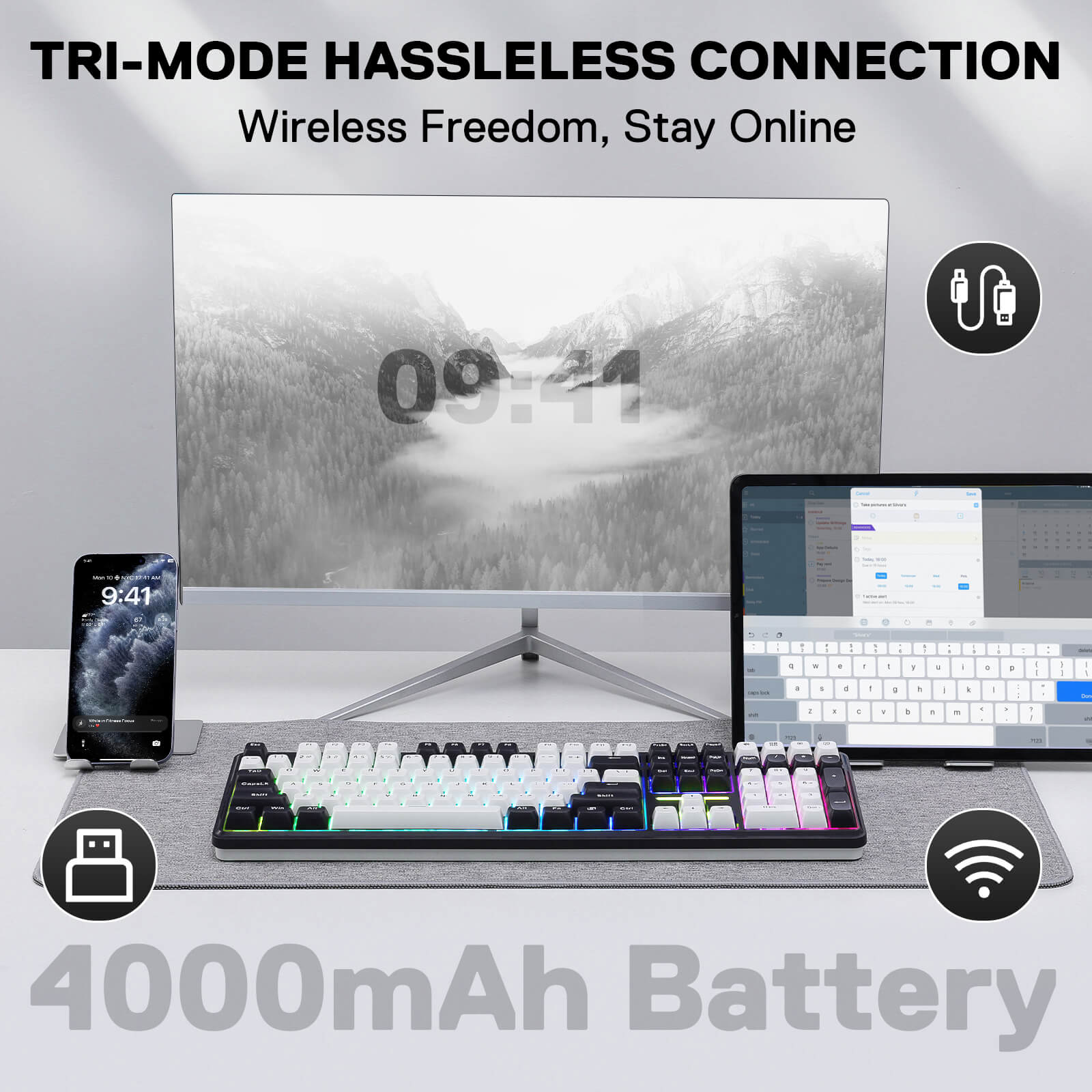 Workstation setup with computer monitor, keyboard, and smartphone on a desk, emphasizing wireless connectivity and battery power.