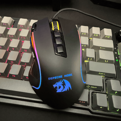 Redragon Gaming mouse with RGB lighting on a keyboard