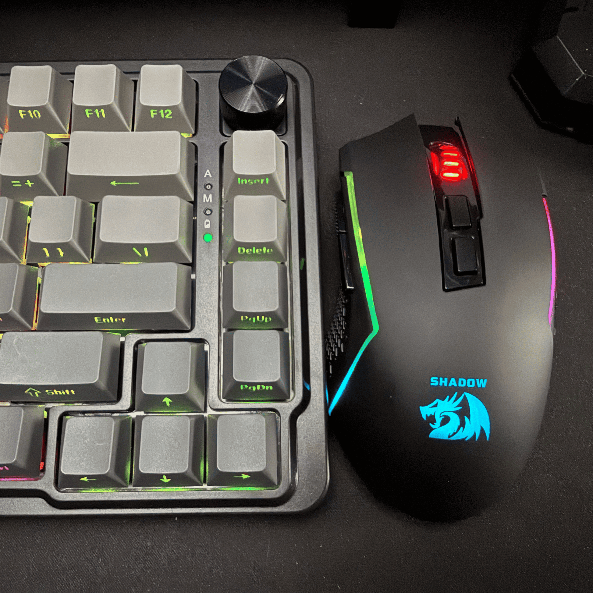 Gaming keyboard and mouse set on a dark surface