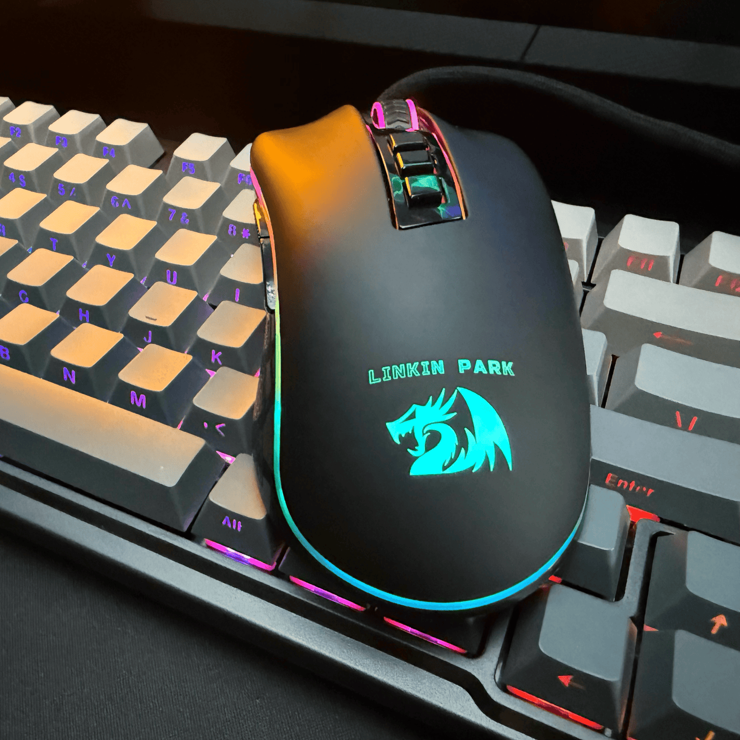 Gaming mouse with Linkin Park logo on a keyboard