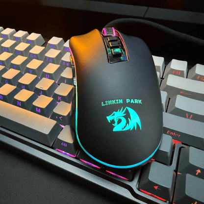 Gaming mouse with Linkin Park logo on a keyboard