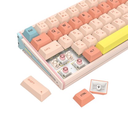 A pastel-colored mechanical keyboard shown on a clean white background, with three loose keycaps displayed in front. The keyboard features cream, peach, pink, light blue, and yellow keys, along with visible switch components and a custom plate.