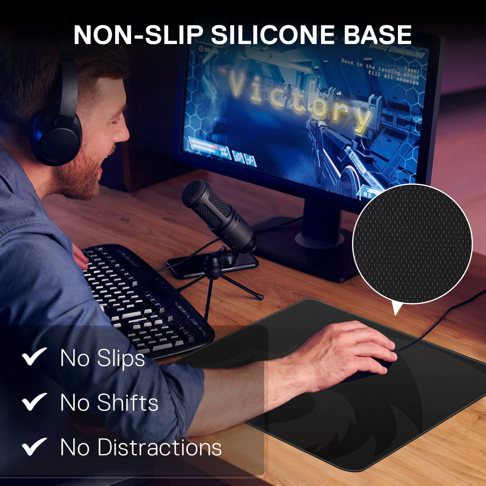 Person using a computer with a non-slip silicone base mat, showing 'Victory' on screen.