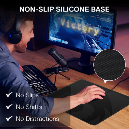Person using a computer with a non-slip silicone base mat, showing 'Victory' on screen.