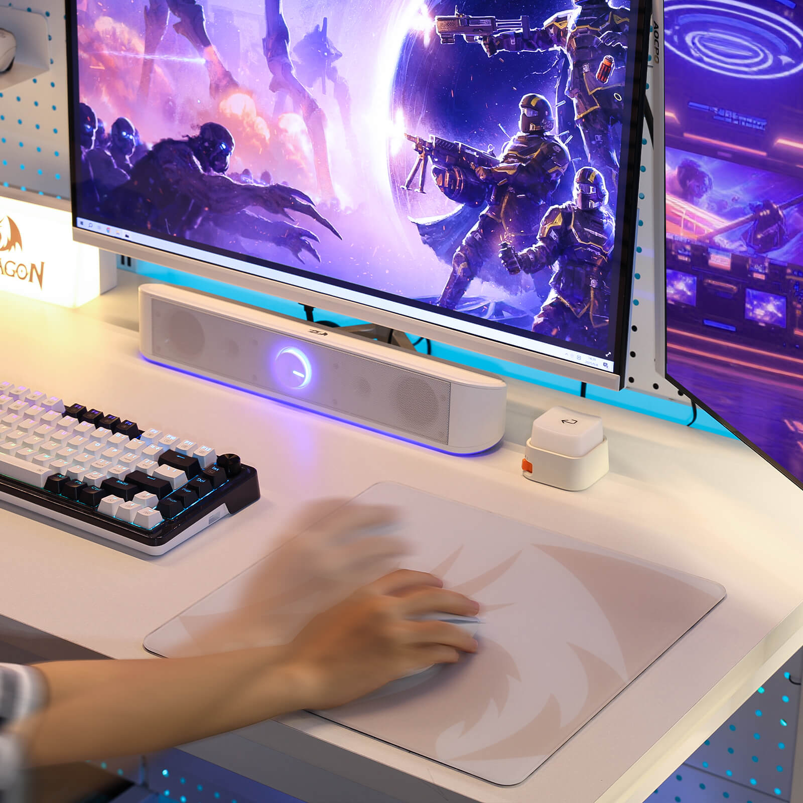 Gaming setup with monitor, keyboard, and mouse on a desk