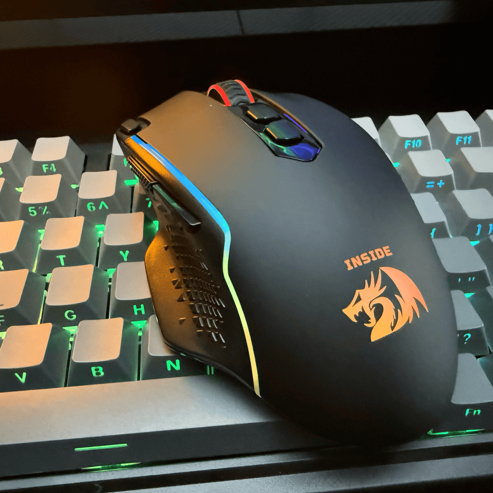 Redragon Gaming mouse with a dragon logo on a keyboard