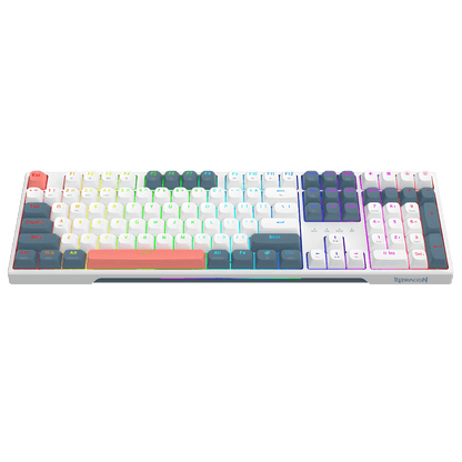 A mechanical keyboard with a white frame and multicolor pastel keycaps arranged in a rainbow gradient pattern, shown against a solid black background.