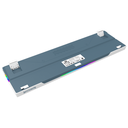 A 3D render of a Noctimark keyboard underside, showing the gray top plate, white side panels, USB-C ports, and a glowing RGB LED strip, set against a solid black background.