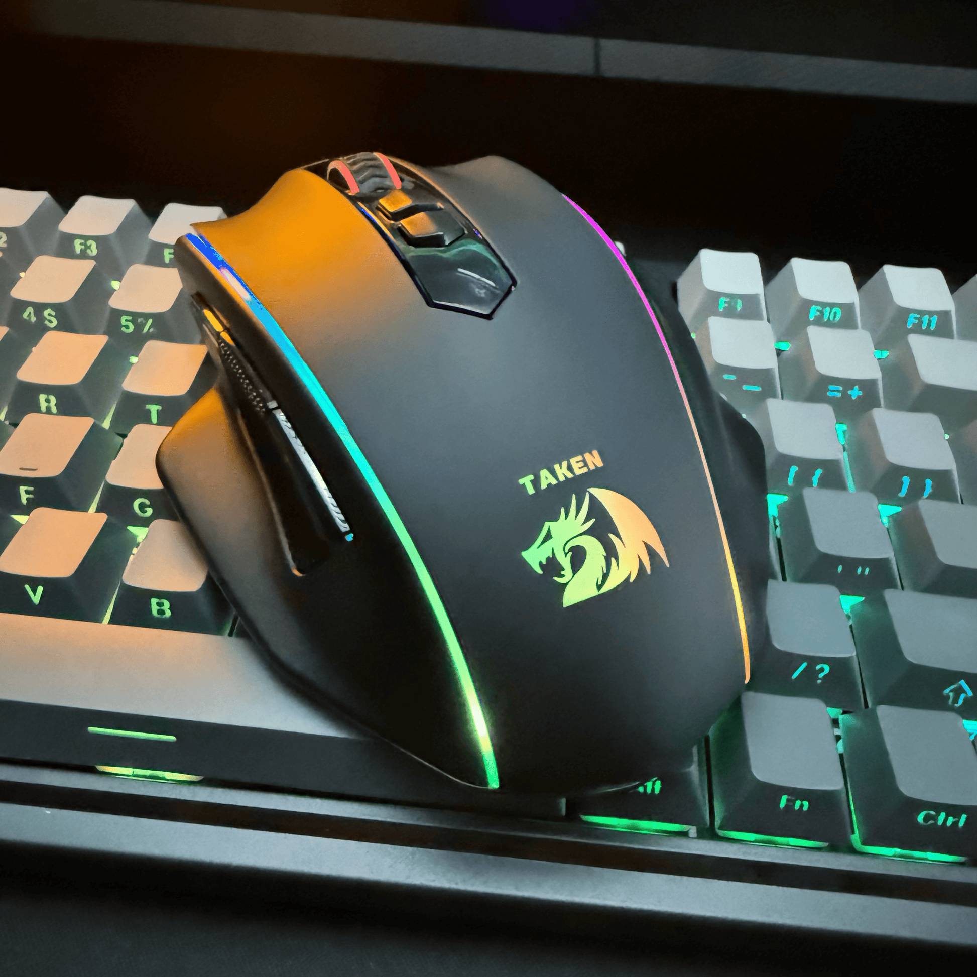 Redragon Gaming mouse with RGB lighting on a keyboard