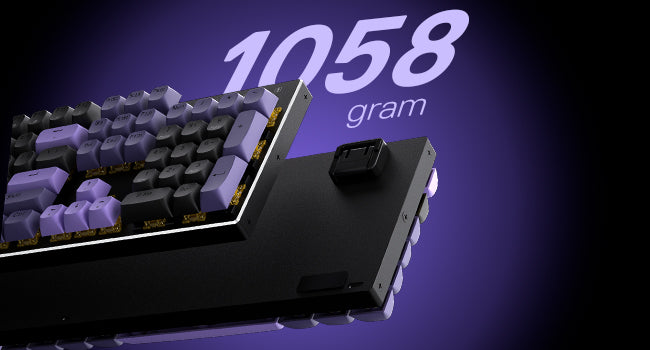 Mechanical keyboard with a purple key and '1058 gram' text on a dark background