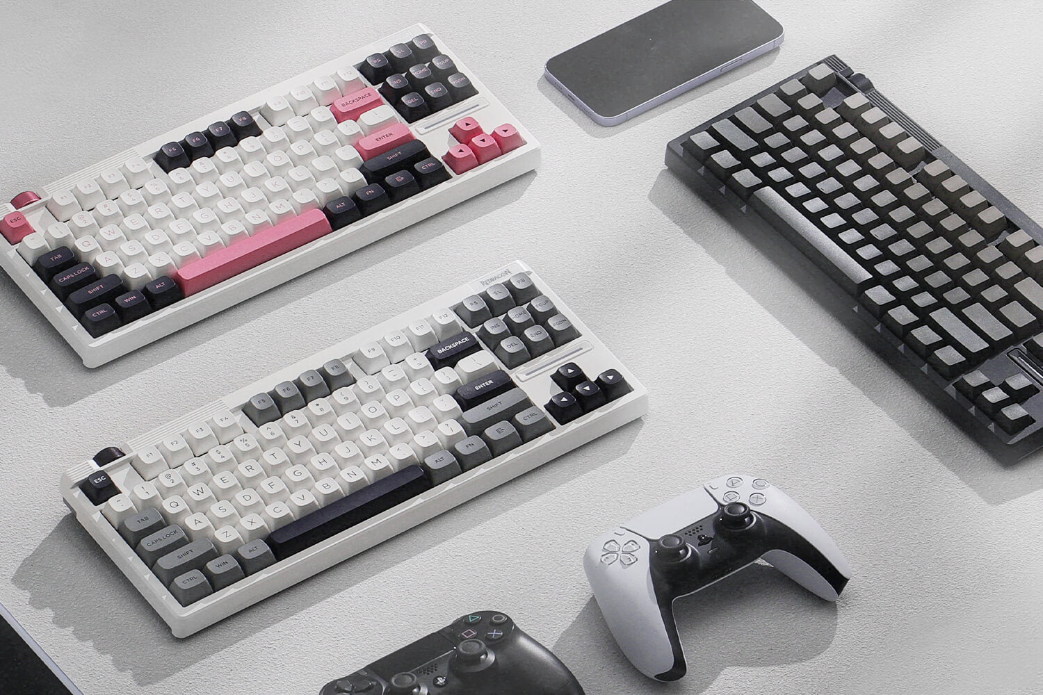 Three Redragon K729 series mechanical keyboards on a light surface with gaming controllers.