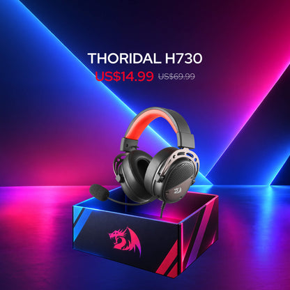 Redragon Mystery Box with randomly selected open-box products,  $14.99 Audio Box, A compact rectangular speaker device with RGB rainbow lighting sits above an open black speaker box with a red dragon logo. The scene has promotional text reading SURGE GS817 and USD$14.