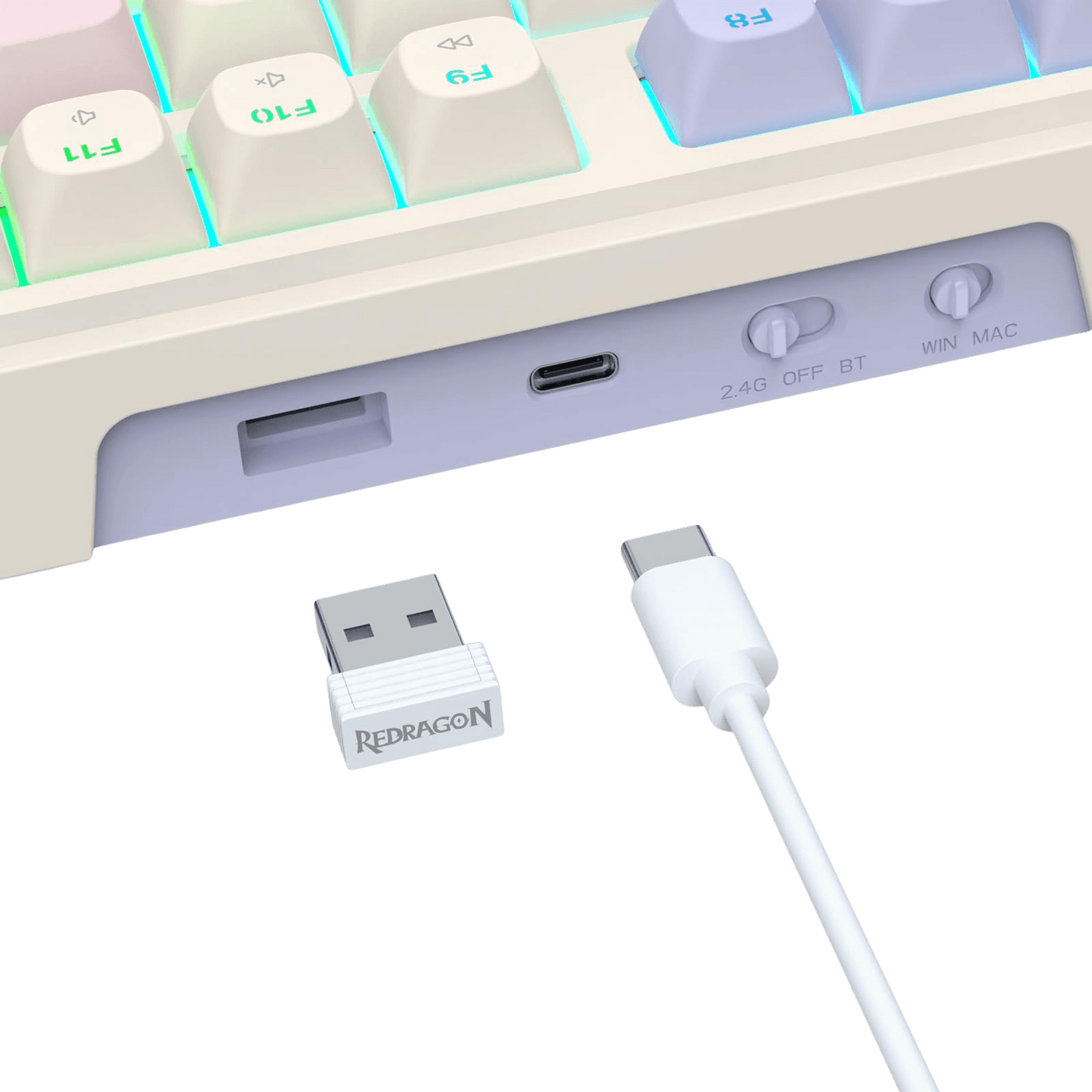 A close-up of a white Redragon USB receiver and matching white USB-C cable shown against a black background, with part of a pastel mechanical keyboard visible at the top.