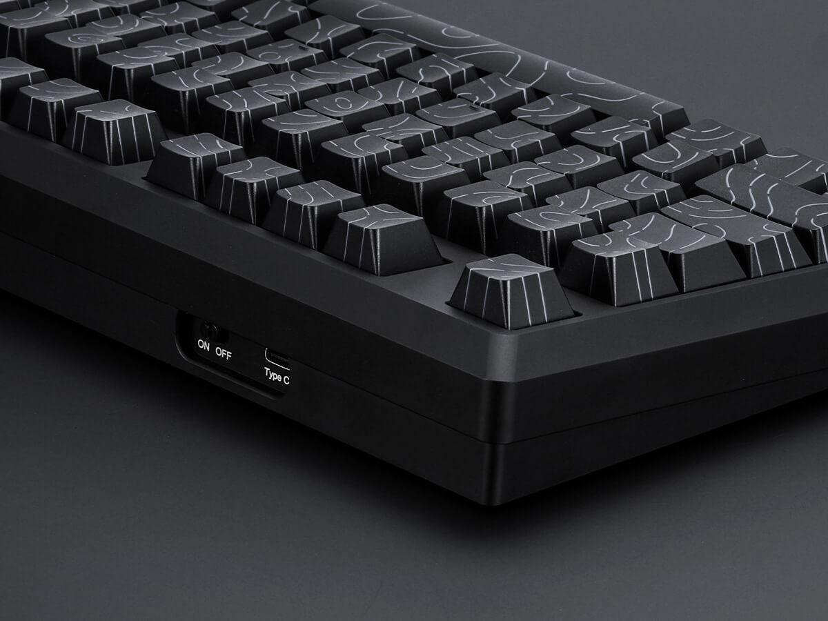 Black mechanical keyboard on a dark background