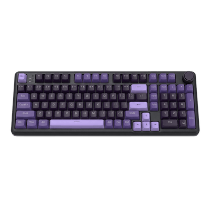 A compact mechanical keyboard with a dark gray/black chassis and keys highlighted in shades of purple, including the spacebar, Enter key, modifier keys, and numeric keypad. A rotary knob is visible in the top-right corner, all set against a plain white background.