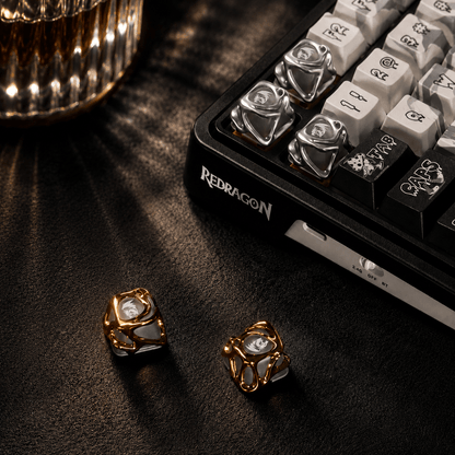 Decorative keycaps on a keyboard with 'Redragon' branding on a dark surface